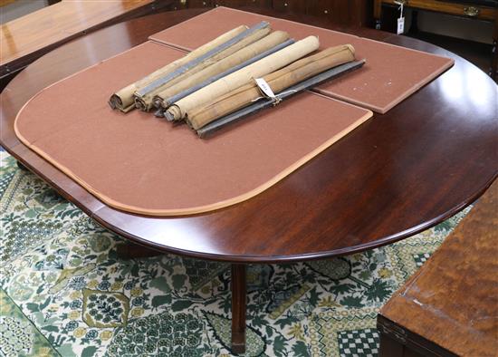 A George III style mahogany extending dining table W.167cm with leaf in